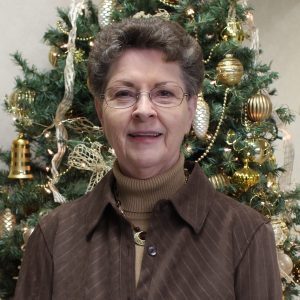 woman in front of a christmas tree